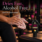 Woman rubbing Lift Hotter alcohol free liquid chalk into her hands that dries fast and is easy on your hands
