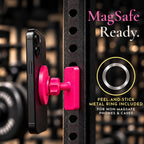 Pink magnetic mount holding a phone on a squat rack, with a peel-and-stick metal ring included for non-MagSafe phones and cases